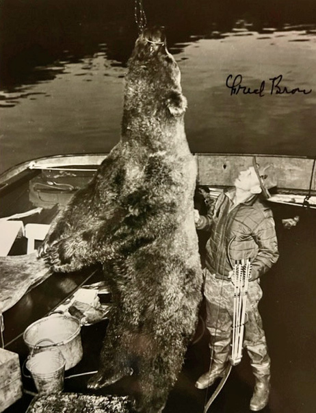 Fred Bear with his record brown bear. For scale, Bear was about 6 feet tall.