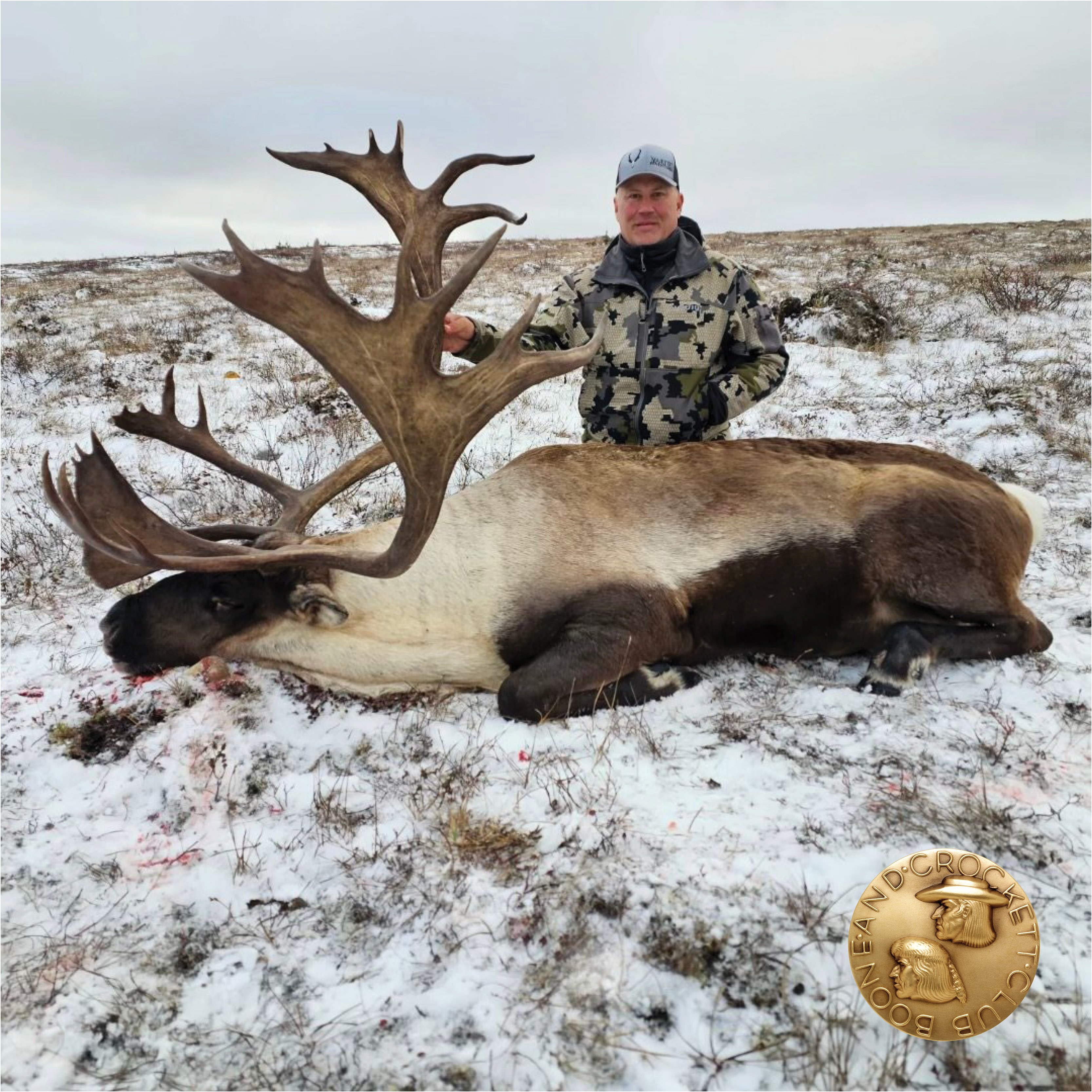 man with caribou