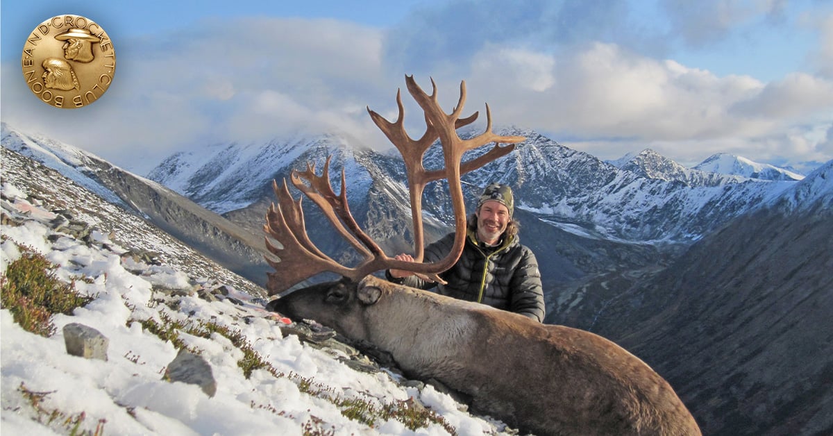 man with caribou