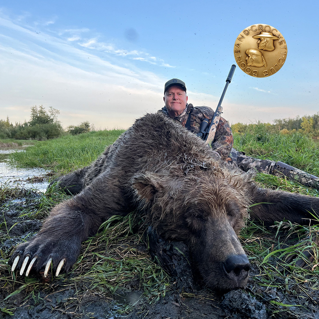 man with brown bear