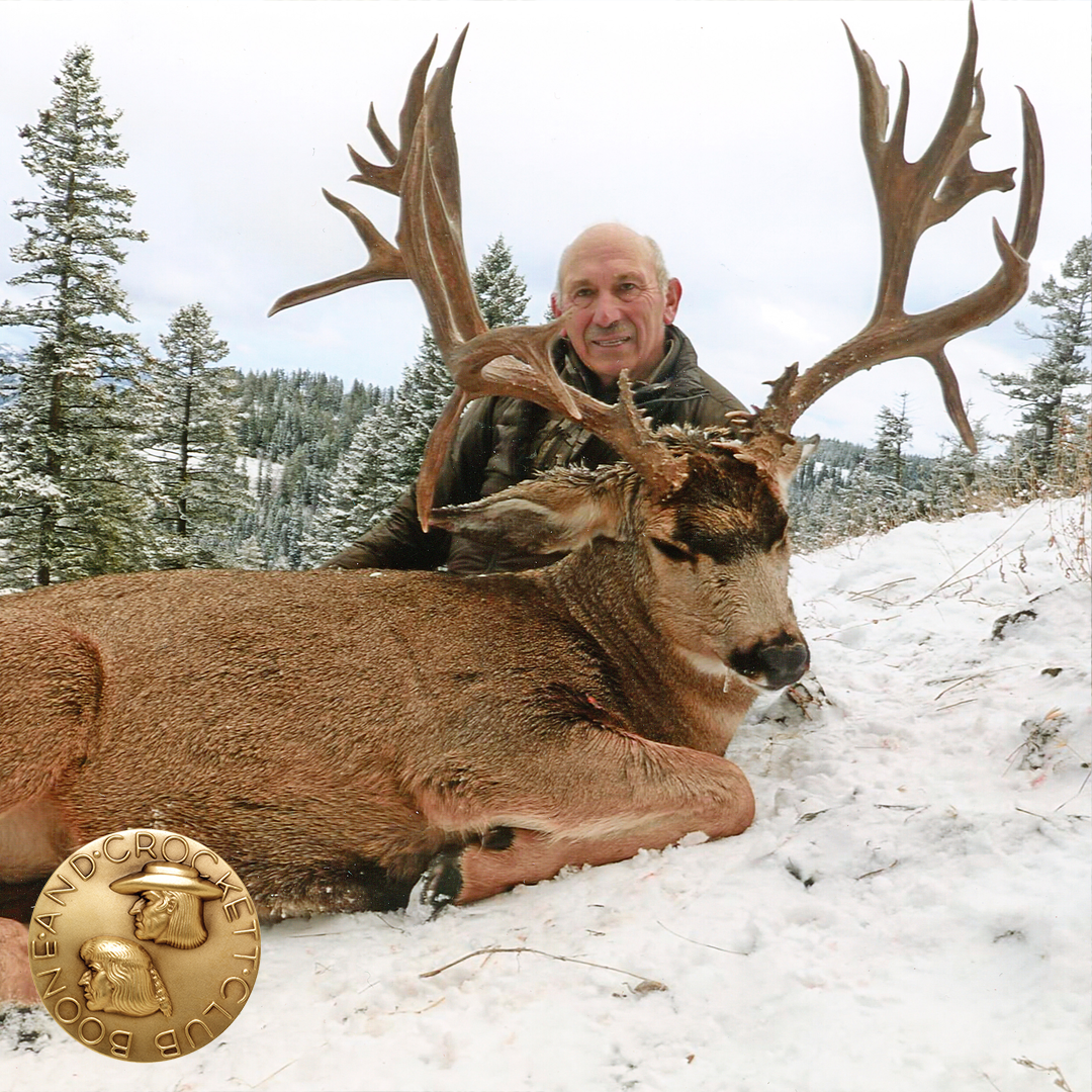 man with mule deer
